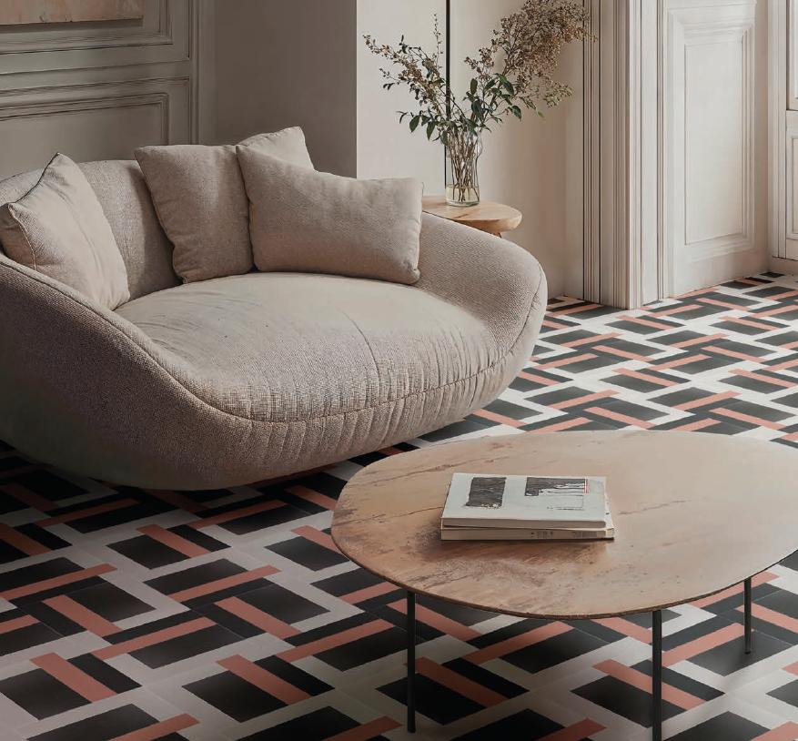 Salón moderno con alfombra decorativa y mobiliario de interiorismo