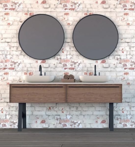 Baño con mármol natural, doble lavabo y espejos redondos